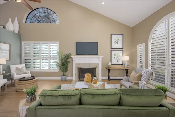 a living room with furniture and a fireplace