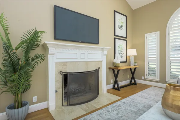 a kitchen with granite countertop white cabinets and stainless steel appliances