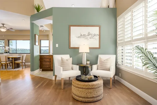 a hall with a sink and large cabinets