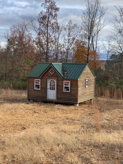 3025 Maple Road Stewart, TN 37175 - Photo 2 of 22 a front view of a house with a yard