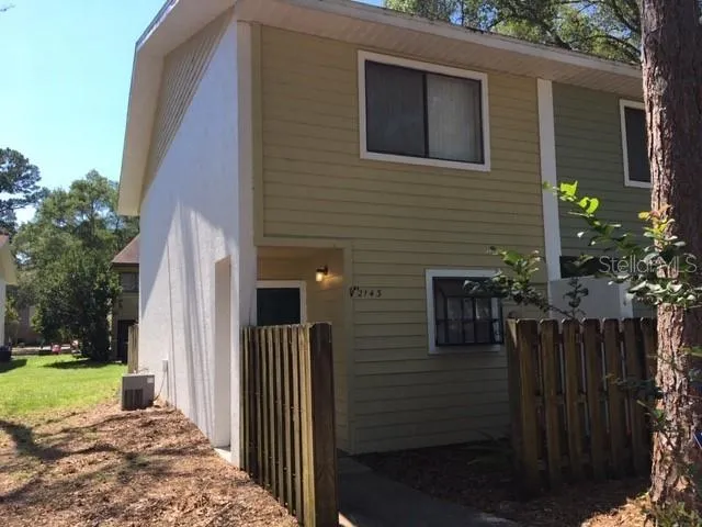 a backyard of a house with lots of green space