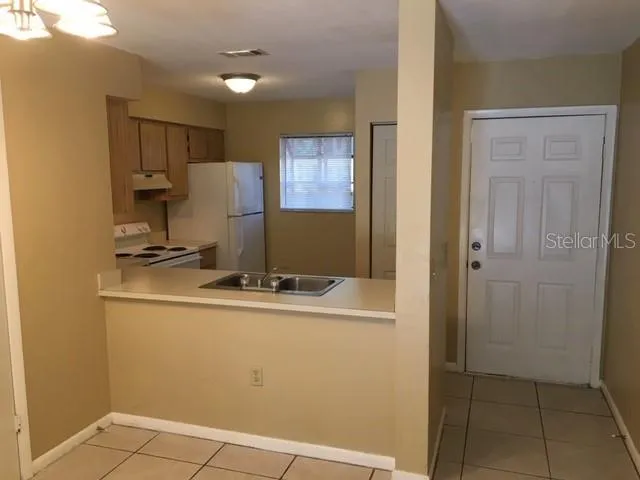 a room with a sink and cabinets