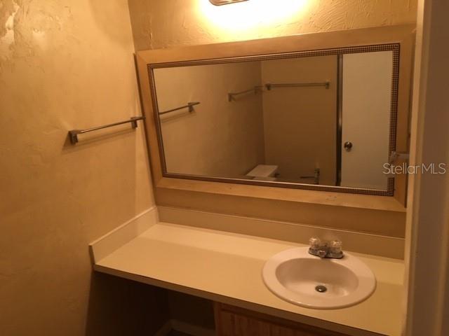 2145 Southwest 39 Way Gainesville, FL 32607 - Photo 9 of 13 a bathroom with a sink and a mirror