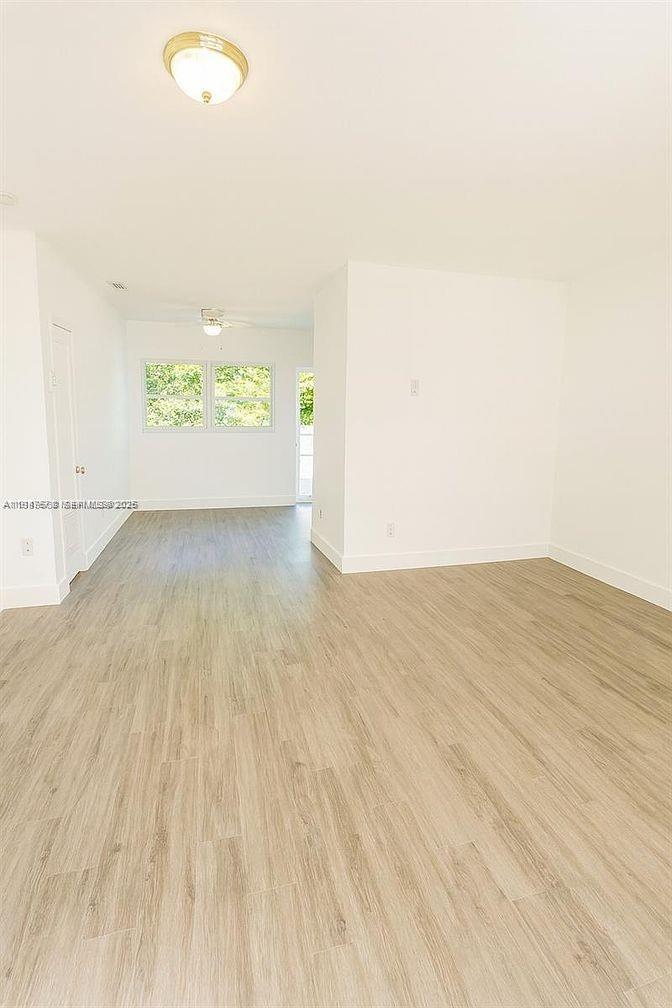 5825 Southwest 9th Terrace, Unit 2 West Miami, FL 33144 - Photo 3 of 11 a view of a room with a wooden floor