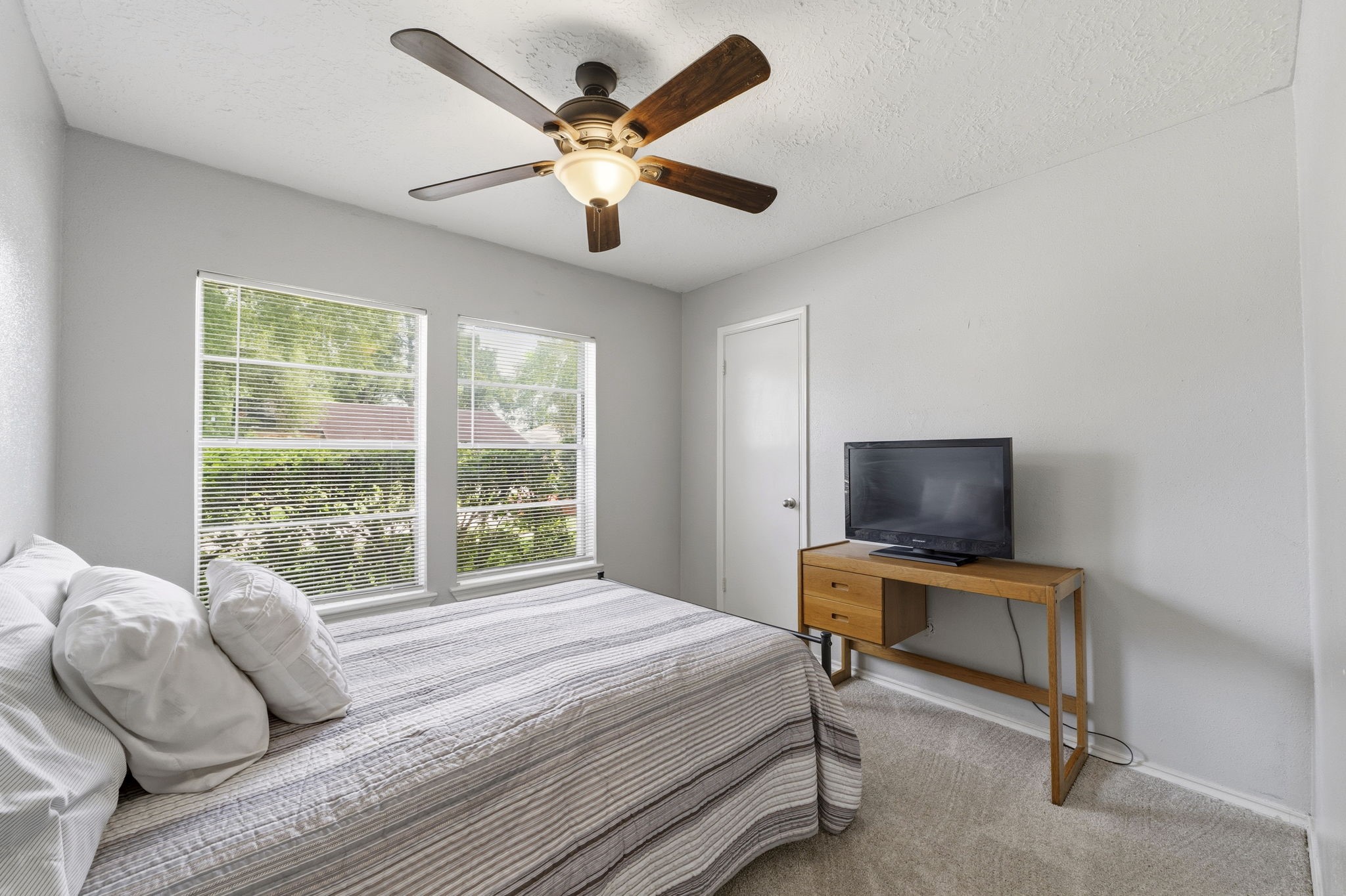 5603 Lynngate Drive Spring, TX 77373 - Photo 19 of 35 Secondary bedroom features ceiling fan, blinds, brand new carpet and walk in closet