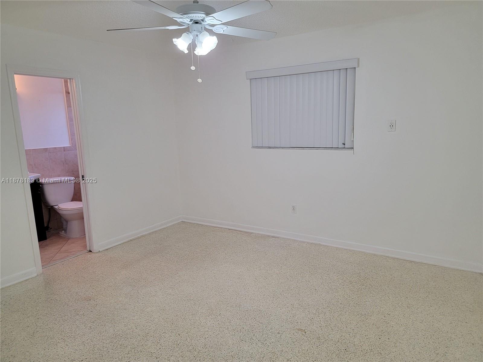 3375 Southwest 28th Street, Unit 3375 Miami, FL 33133 - Photo 11 of 20 an empty room with a bathroom