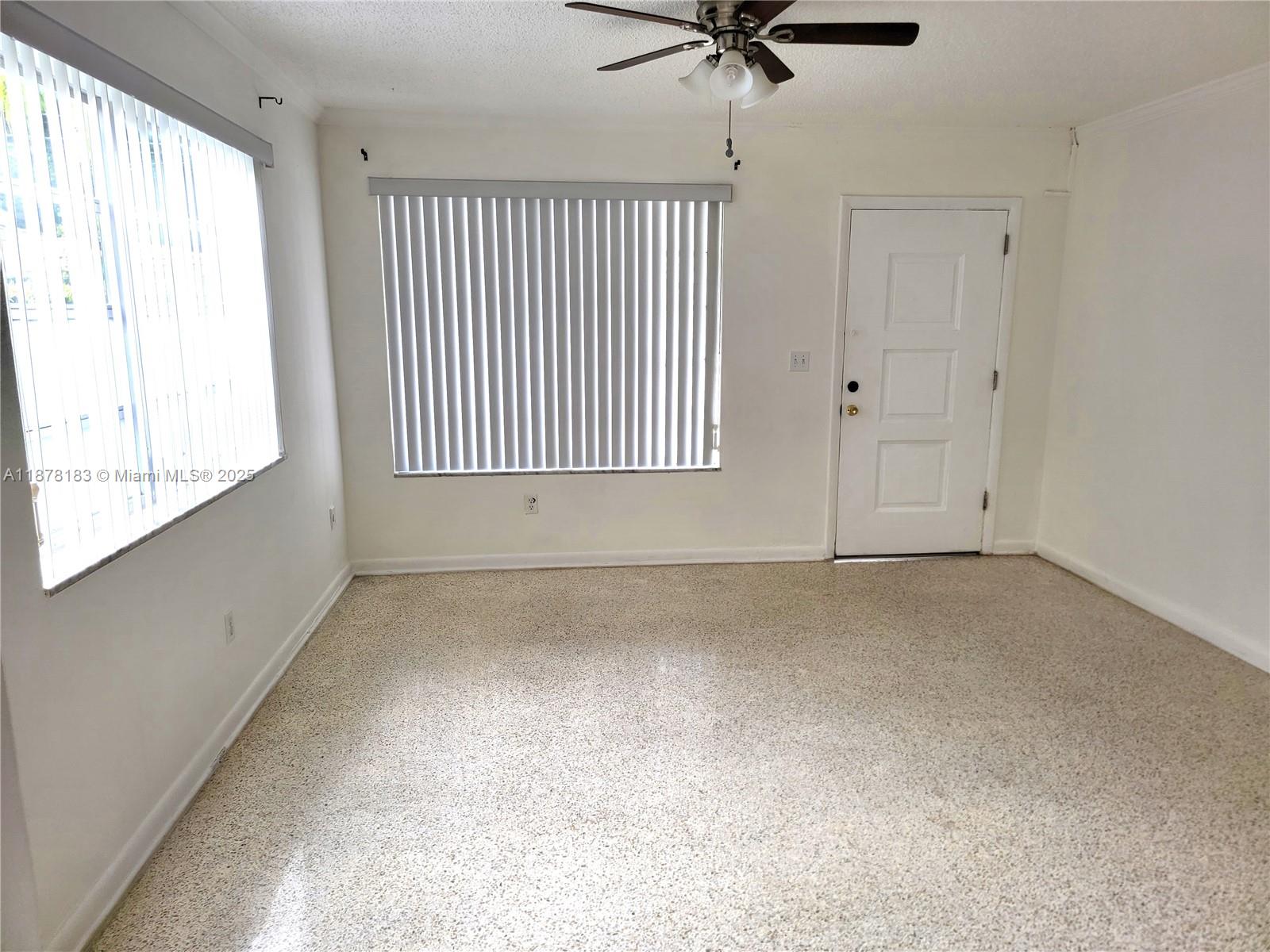 3375 Southwest 28th Street, Unit 3375 Miami, FL 33133 - Photo 2 of 20 a view of an empty room with a window