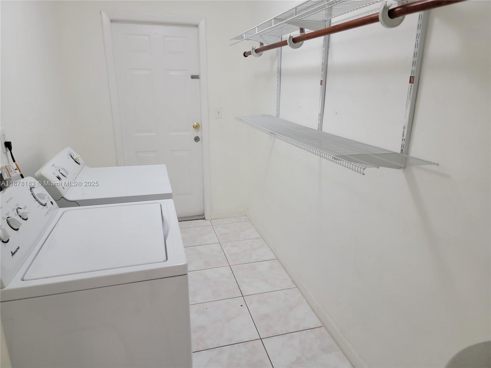3375 Southwest 28th Street, Unit 3375 Miami, FL 33133 - Photo 6 of 20 a utility room with dryer and washer