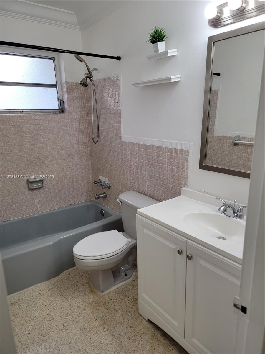 3375 Southwest 28th Street, Unit 3375 Miami, FL 33133 - Photo 8 of 20 a bathroom with a sink a toilet and shower