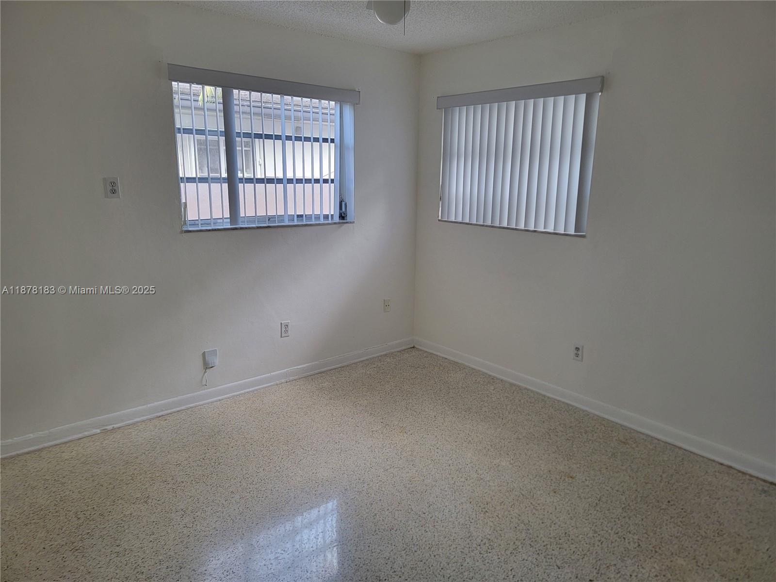 3375 Southwest 28th Street, Unit 3375 Miami, FL 33133 - Photo 9 of 20 an empty room with a window