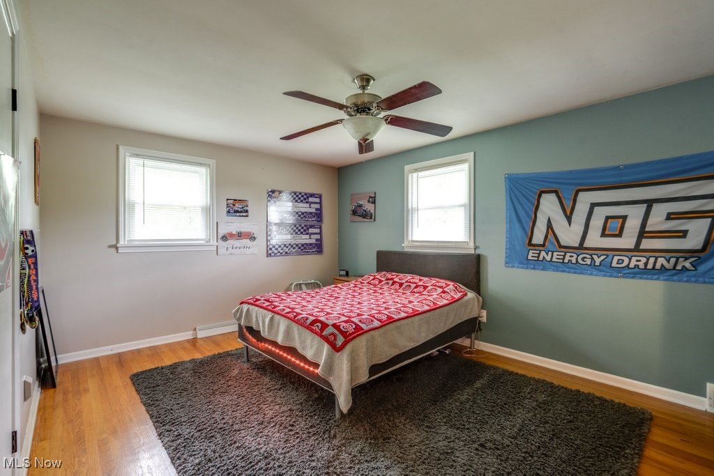 5867 Wiclif Road Northeast Canton, OH 44721 - Photo 29 of 45 Bedroom featuring light wood-type flooring, baseboards, and ceiling fan