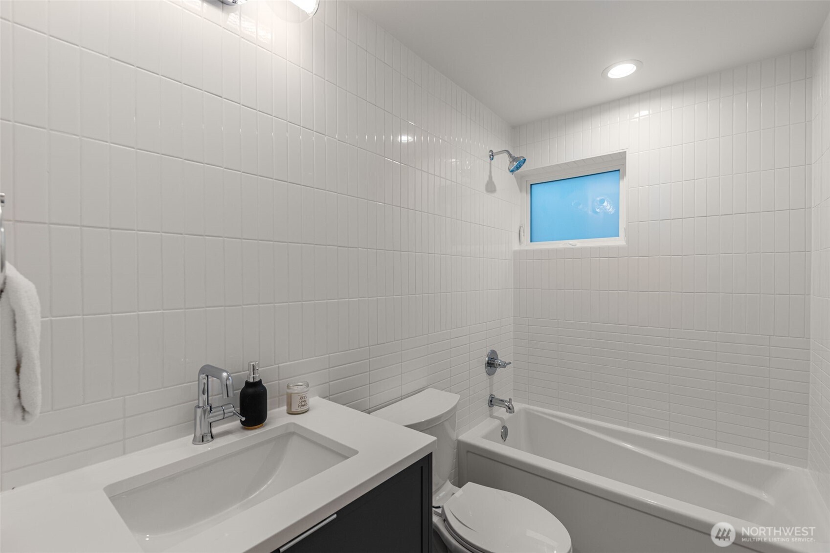 315 Northwest 86th Street, Unit B Seattle, WA 98117 - Photo 11 of 17 a bathroom with a sink toilet and shower