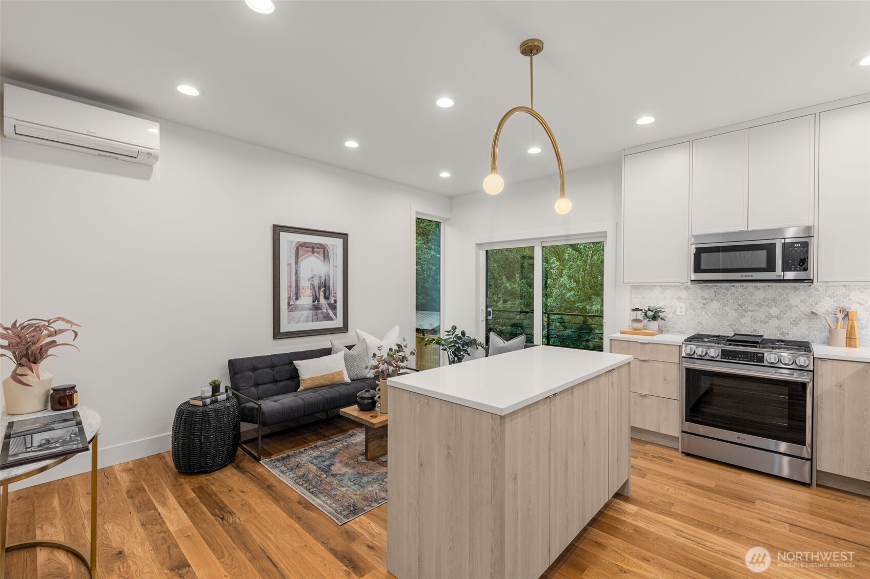 315 Northwest 86th Street, Unit B Seattle, WA 98117 - Photo 6 of 17 a kitchen with sink a stove and cabinets