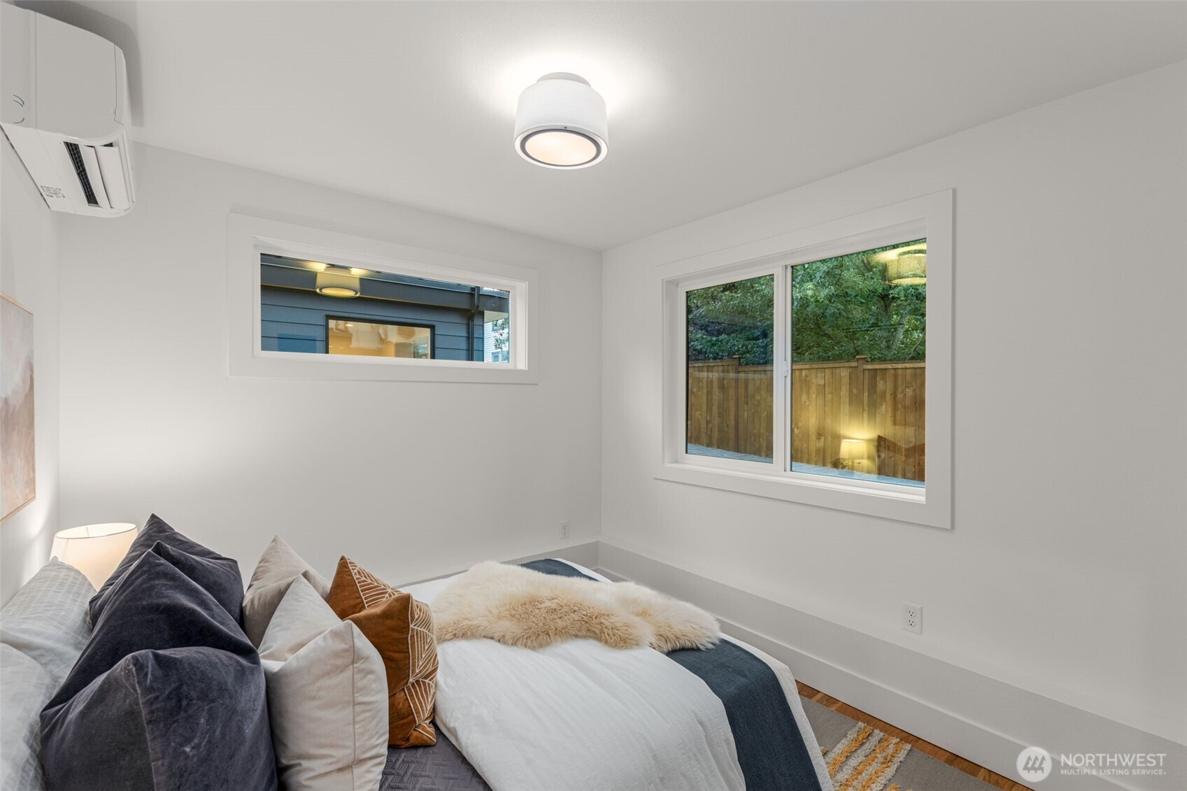 315 Northwest 86th Street, Unit B Seattle, WA 98117 - Photo 10 of 17 a bedroom with a bed and a window
