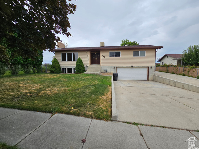 491 Eastridge Road Price, UT 84501 - Photo 1 of 1 Split foyer home with a garage and a front lawn