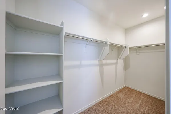 a view of an empty walk in closet