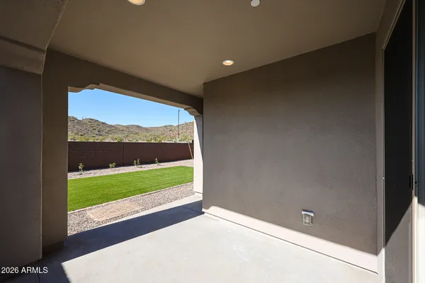 a view of hallway with a large window and a yard