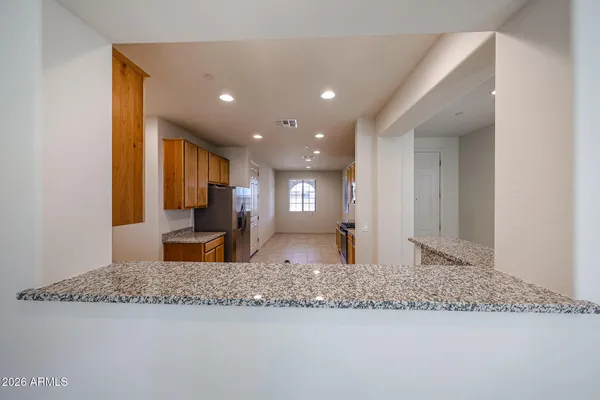 a view of a living room and kitchen