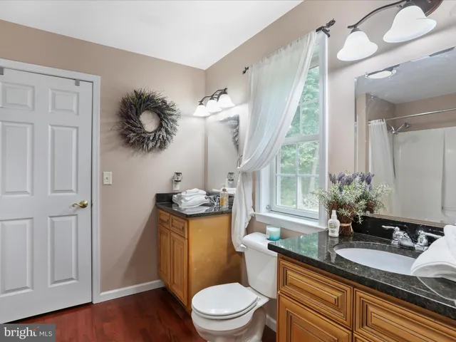 a view of entryway with wooden floor and stairs