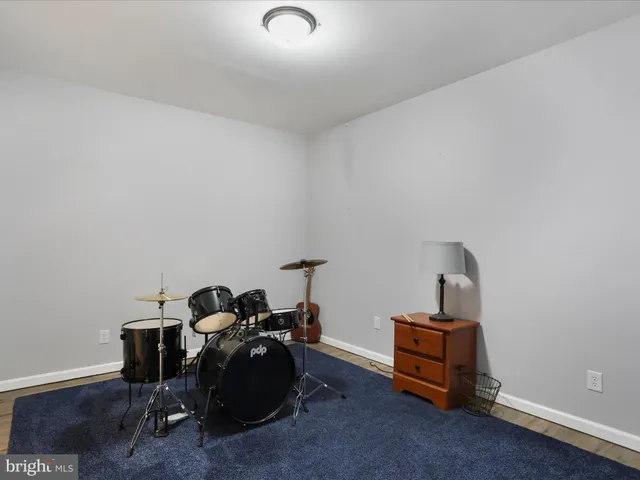 a view of a garage with a bike and car