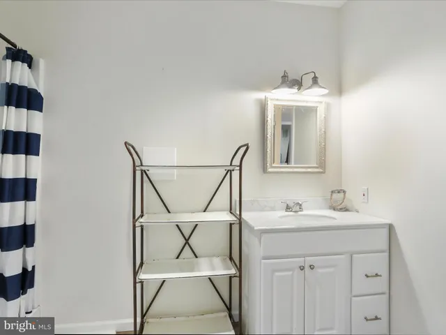 a view of a roof deck with wooden floor and outdoor seating