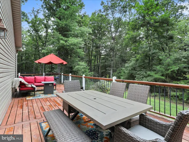 a view of a small car is parked in front of a house