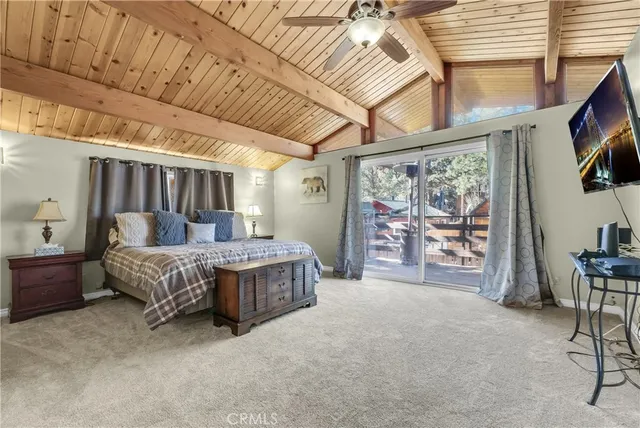 a spacious bedroom with a bed and a walk in closet