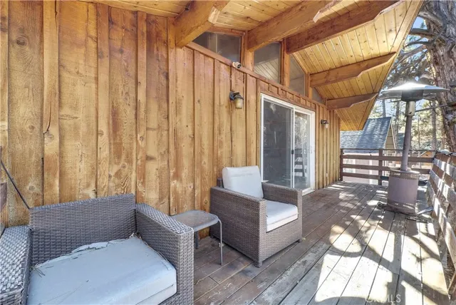 a spacious bedroom with a bed and a chandelier