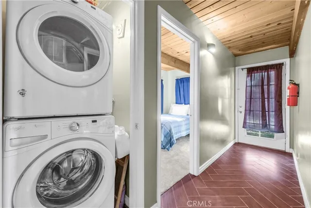 a view of a hallway with washer and dryer