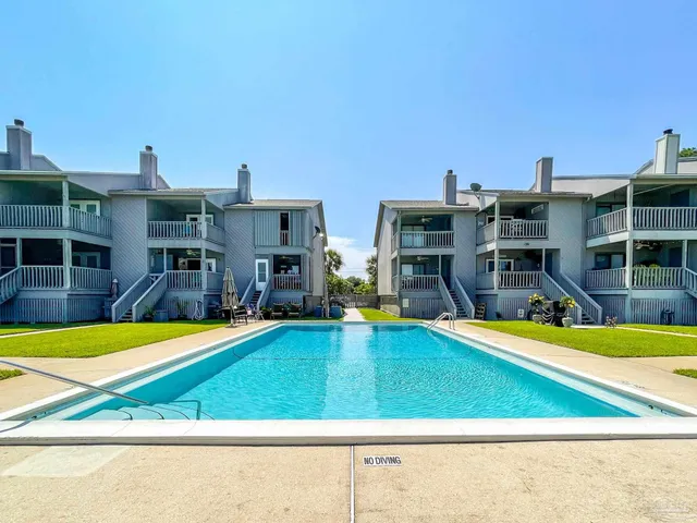 a view of a swimming pool with a lounge chairs