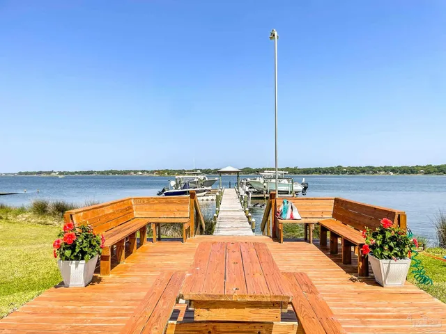 a wooden floor with a lake view