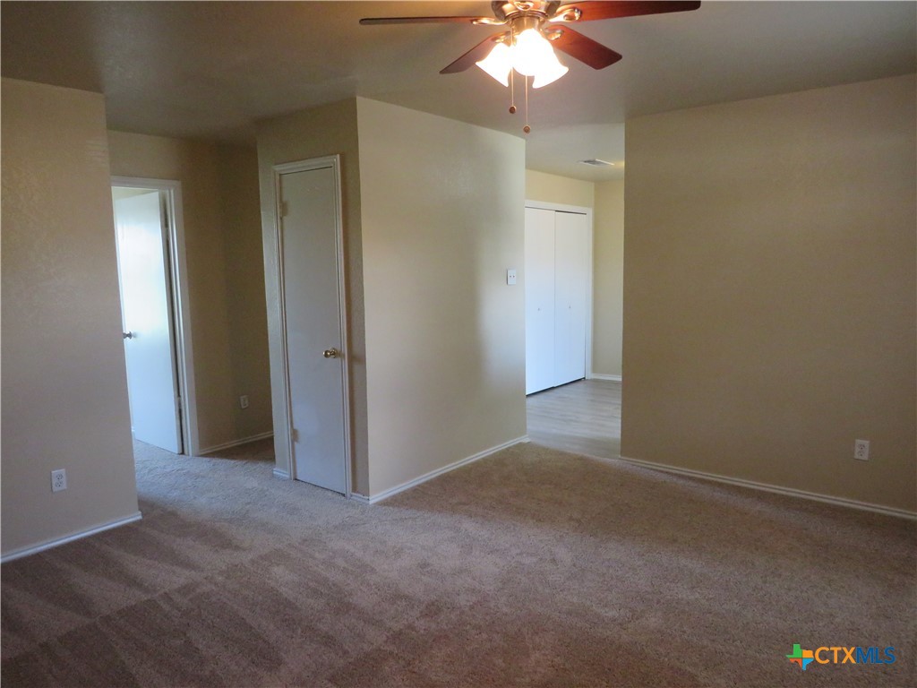 1602 Benttree Drive, Unit B Killeen, TX 76543 - Photo 2 of 15 an empty room with chandelier fan