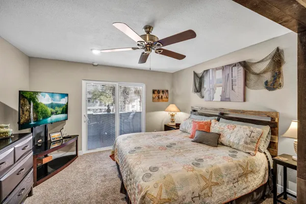 a kitchen with stainless steel appliances granite countertop a sink a stove and a wooden floors