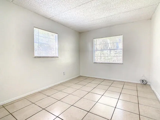 a view of an empty room and window