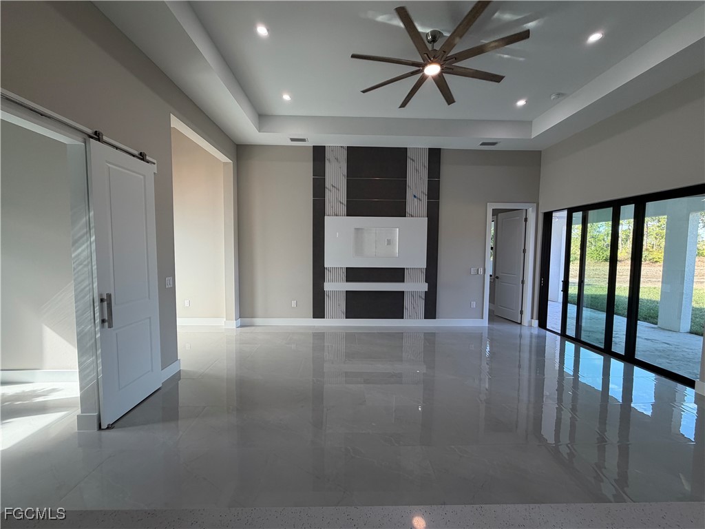 7968 3rd Terrace Lehigh Acres, FL 33936 - Photo 16 of 18 a view of an empty room with a window and a kitchen