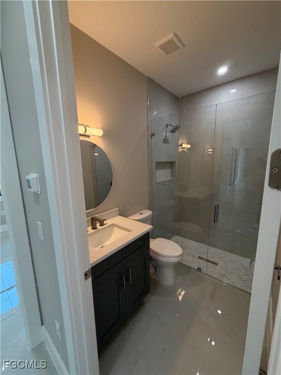 7968 3rd Terrace Lehigh Acres, FL 33936 - Photo 18 of 18 a bathroom with a granite countertop sink toilet and shower