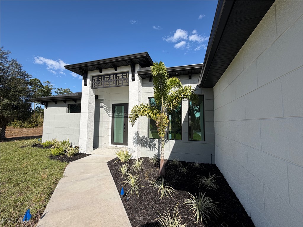 7968 3rd Terrace Lehigh Acres, FL 33936 - Photo 5 of 18 a front view of a house with a yard