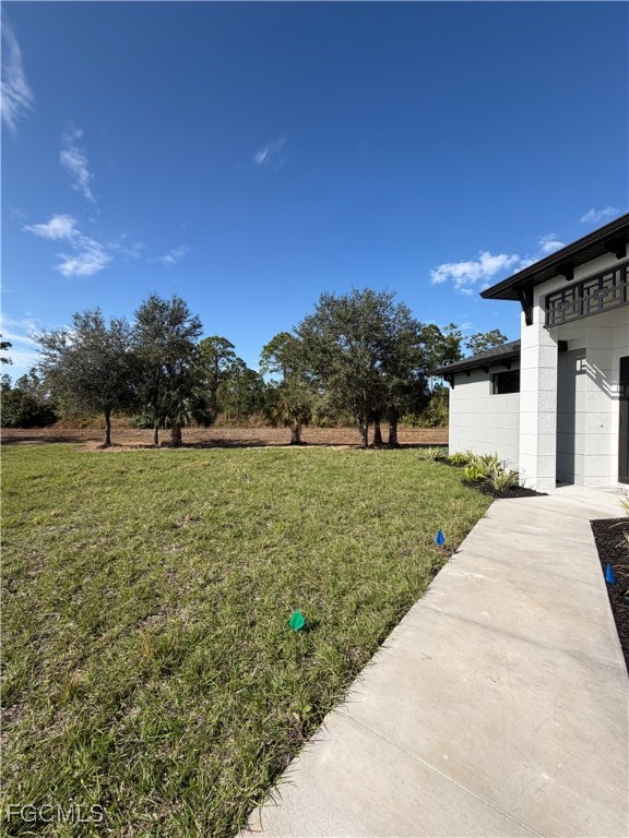 7968 3rd Terrace Lehigh Acres, FL 33936 - Photo 7 of 18 a view of a house with a yard