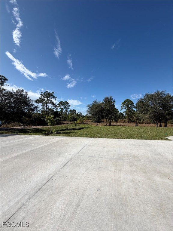 7968 3rd Terrace Lehigh Acres, FL 33936 - Photo 8 of 18 a view of an outdoor space and yard