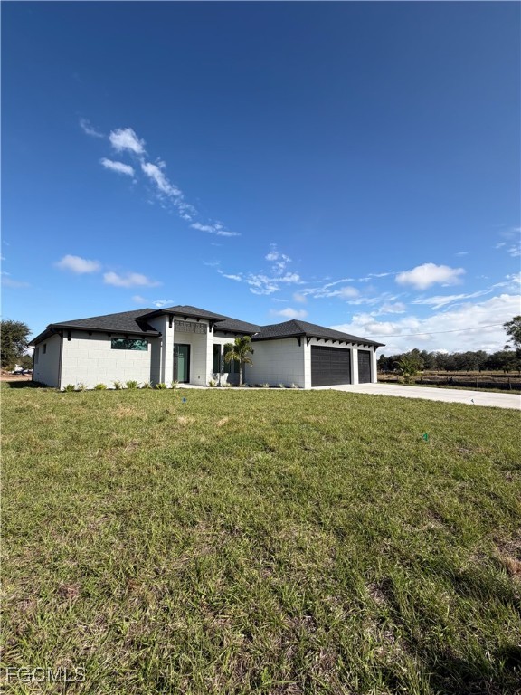 7968 3rd Terrace Lehigh Acres, FL 33936 - Photo 9 of 18 a front view of a house with a yard