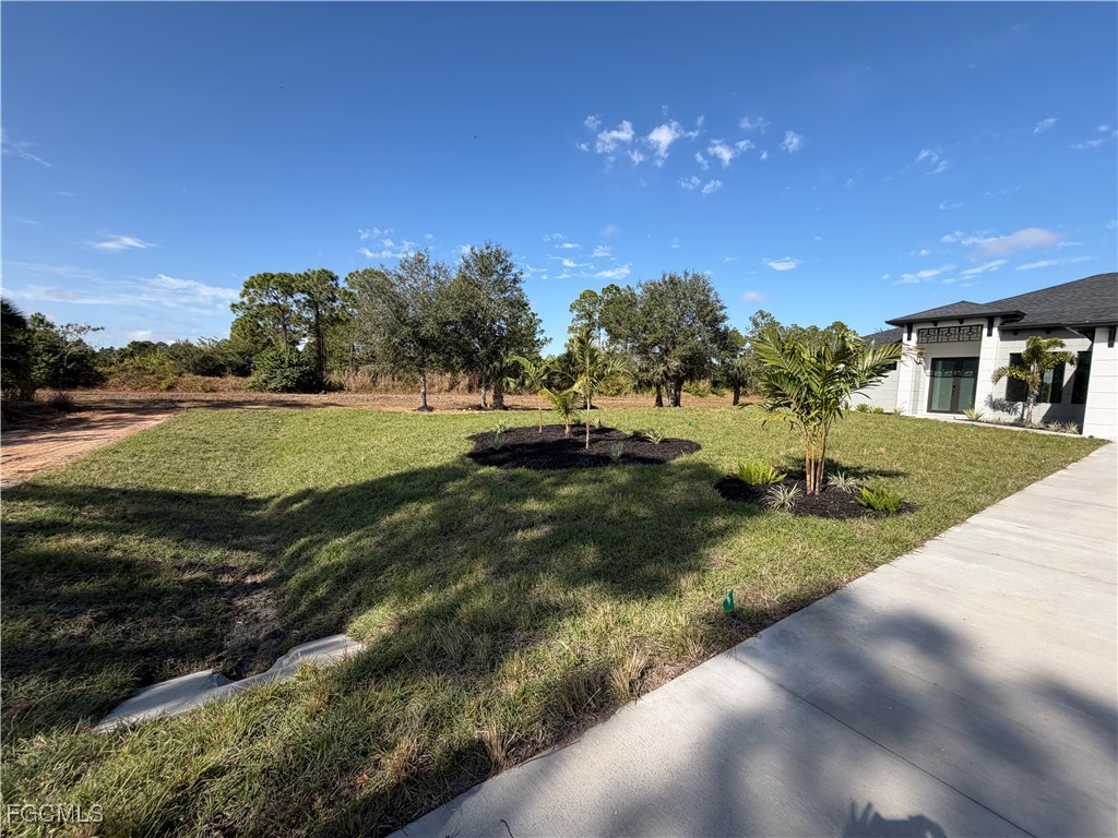 7968 3rd Terrace Lehigh Acres, FL 33936 - Photo 10 of 18 a view of a house with a yard