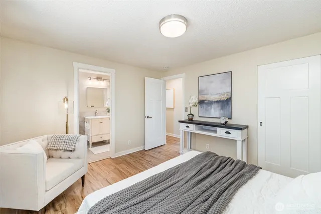 a bedroom with a bed and a stove