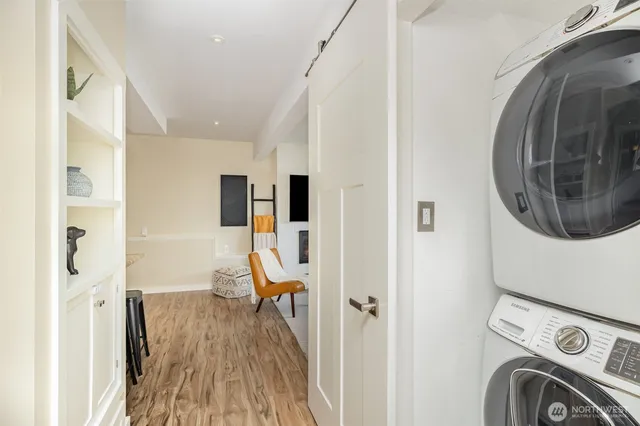a view of a hallway with washer and dryer