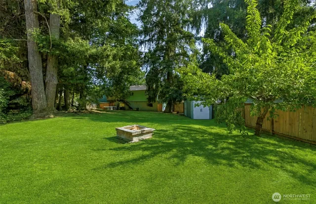 a garden with trees in front of it