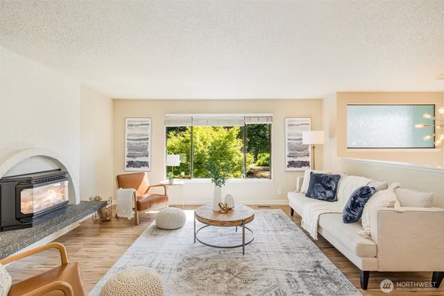 a living room with furniture and a large window
