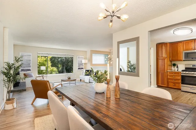 a view of a dining room with furniture window and wooden floor