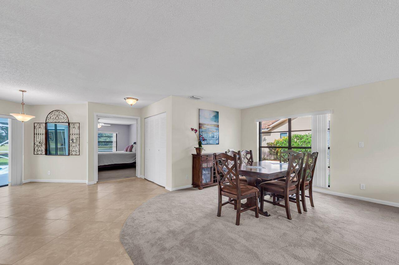 19699 Boca Greens Drive Boca Raton, FL 33498 - Photo 11 of 43 a dining room with furniture and window