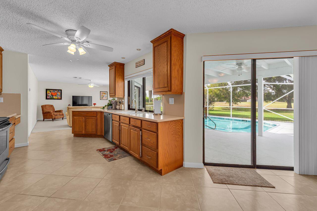 19699 Boca Greens Drive Boca Raton, FL 33498 - Photo 20 of 43 a room with a bed and a chandelier