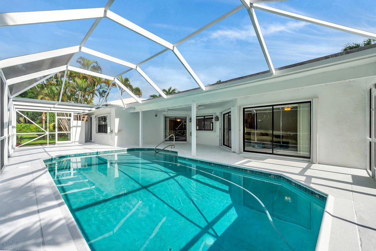 19699 Boca Greens Drive Boca Raton, FL 33498 - Photo 28 of 43 a view of a house with a backyard