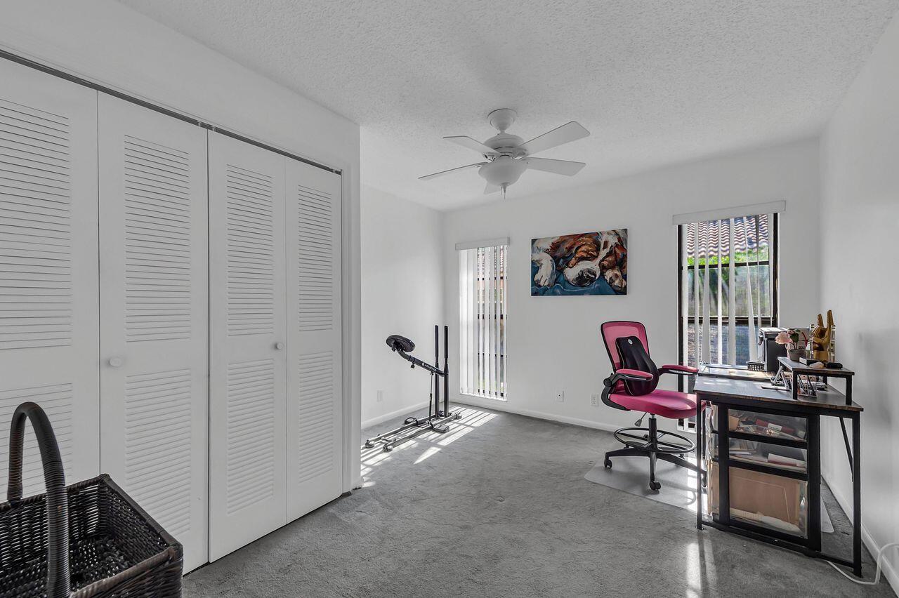 19699 Boca Greens Drive Boca Raton, FL 33498 - Photo 34 of 43 a living room with furniture